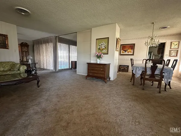 a view of a livingroom with furniture and windows