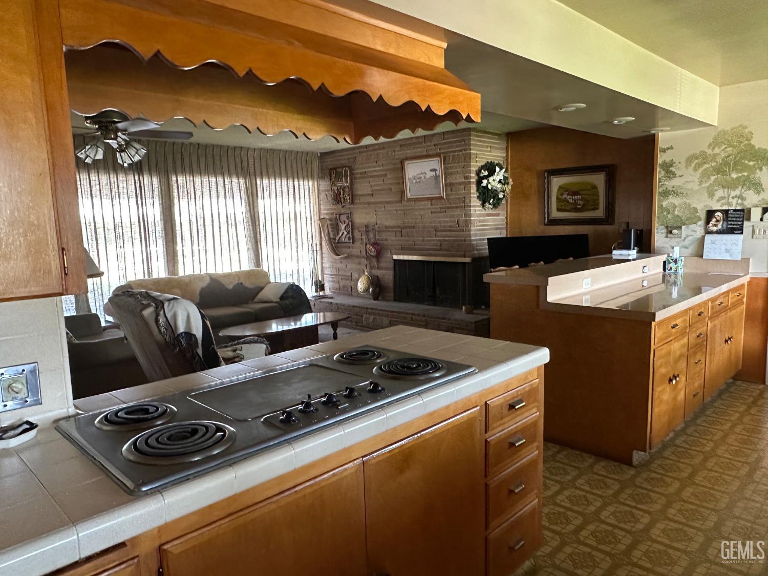 Undisclosed Address Wasco, CA 93280 - Photo 9 of 11 a kitchen with a stove and a microwave