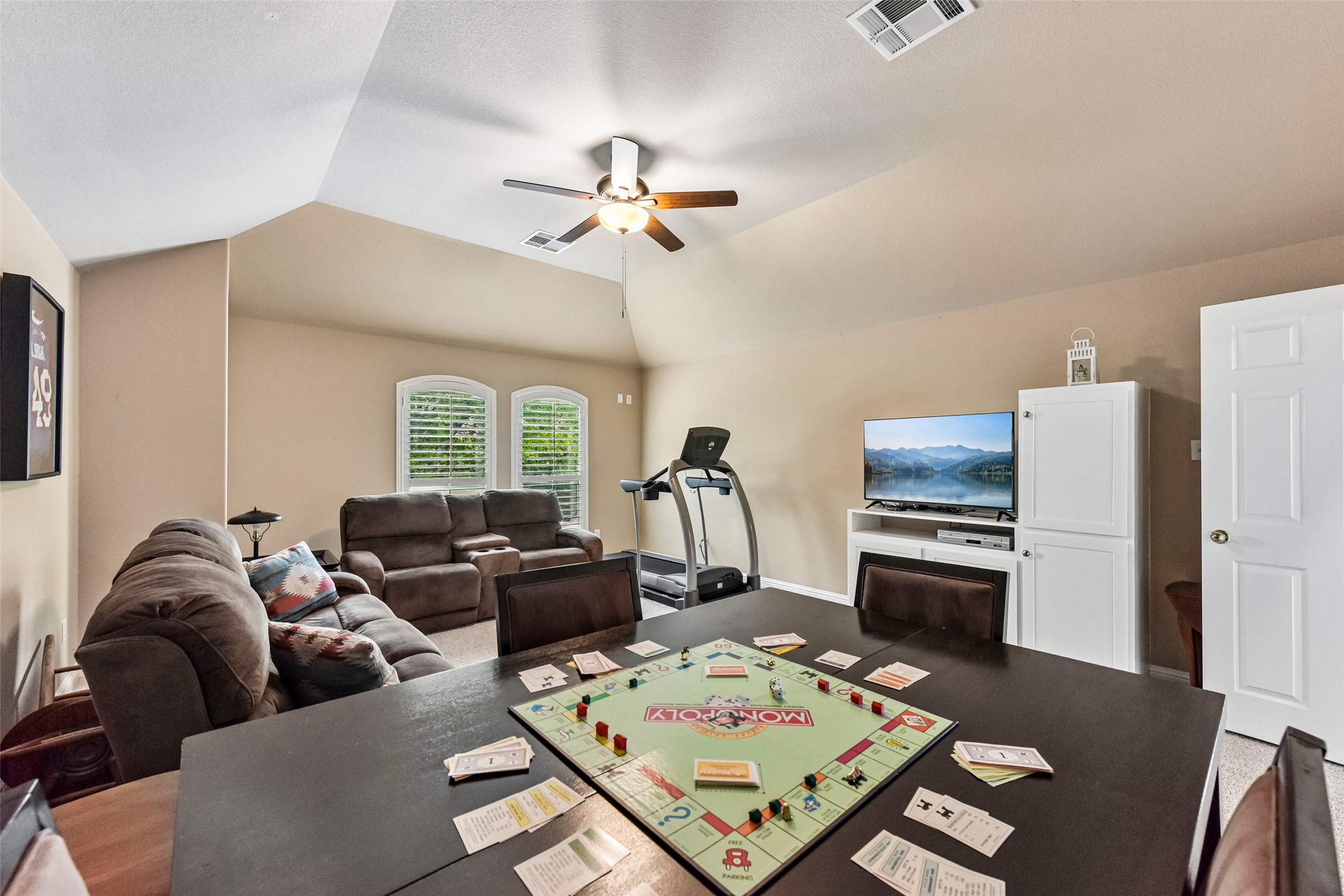 10216 Anahuac Trail Austin, TX 78747 - Photo 14 of 39 a living room with furniture a flat screen tv and a table