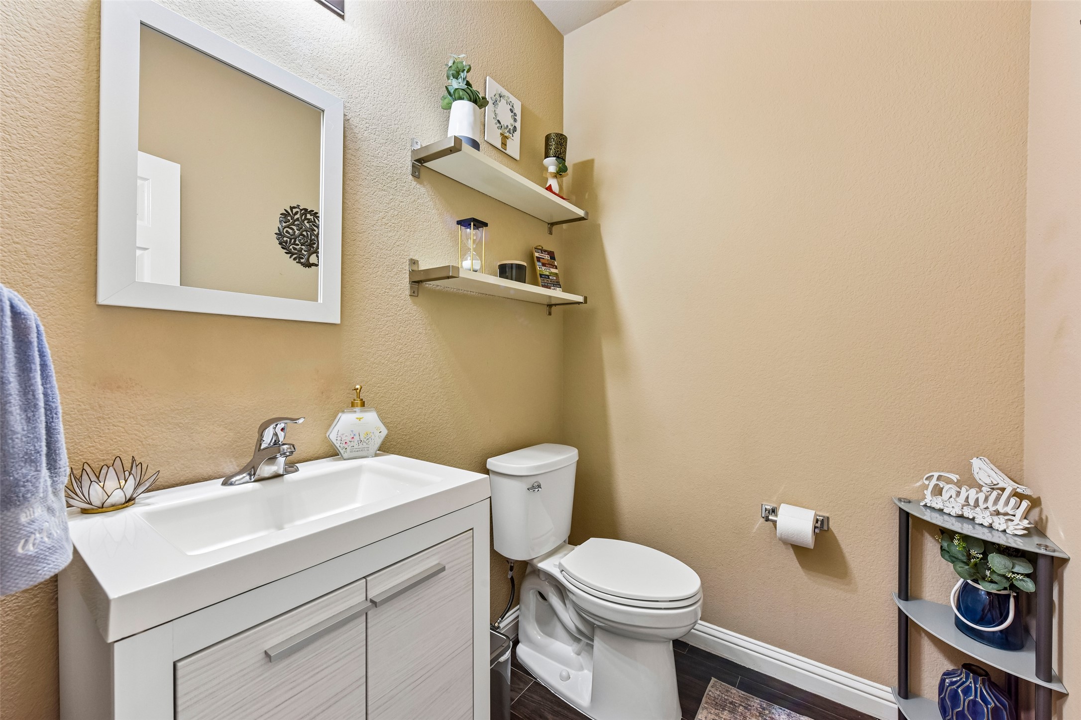 10216 Anahuac Trail Austin, TX 78747 - Photo 20 of 39 a bathroom with a sink mirror and toilet