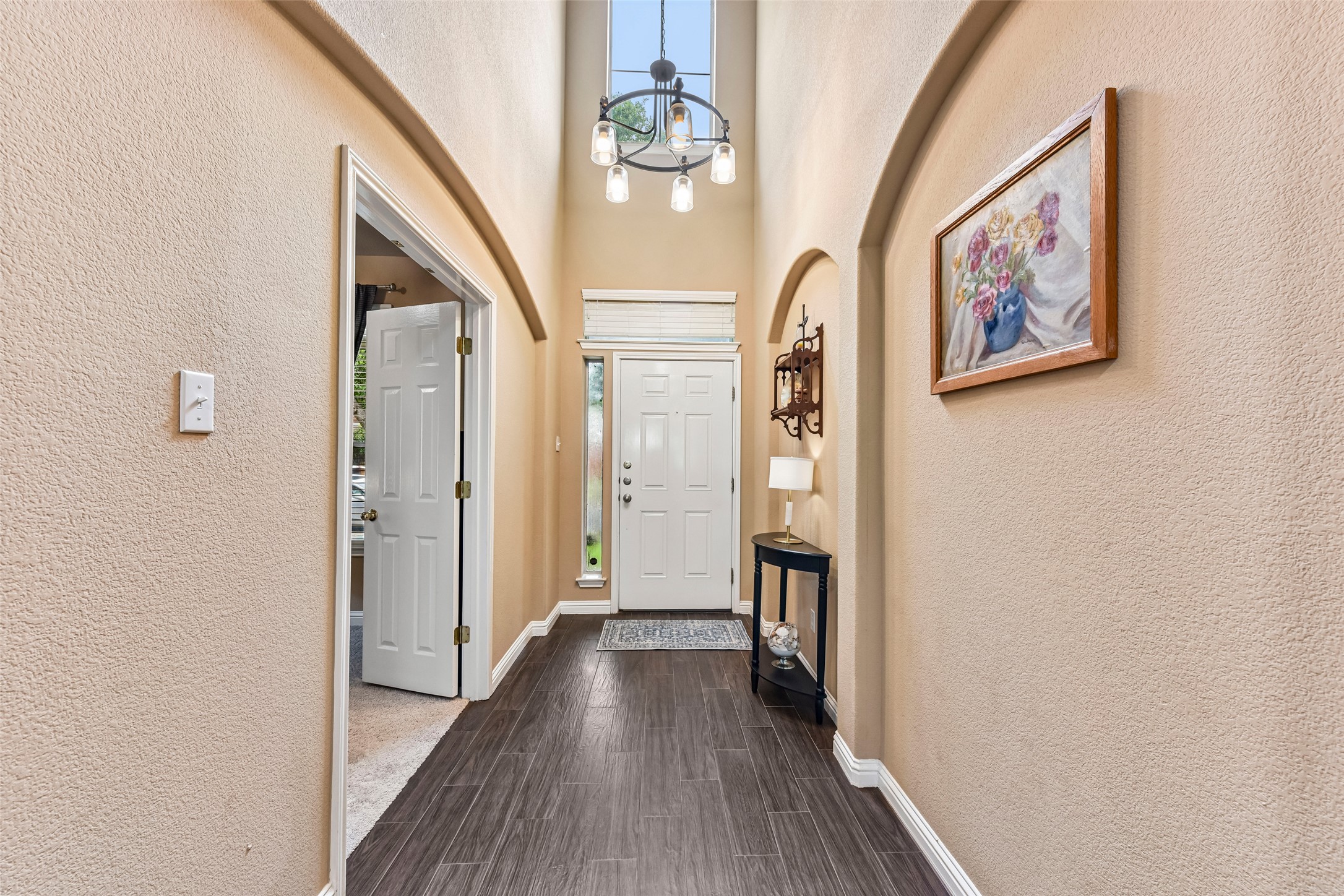 10216 Anahuac Trail Austin, TX 78747 - Photo 4 of 39 a view of hallway with wooden floor