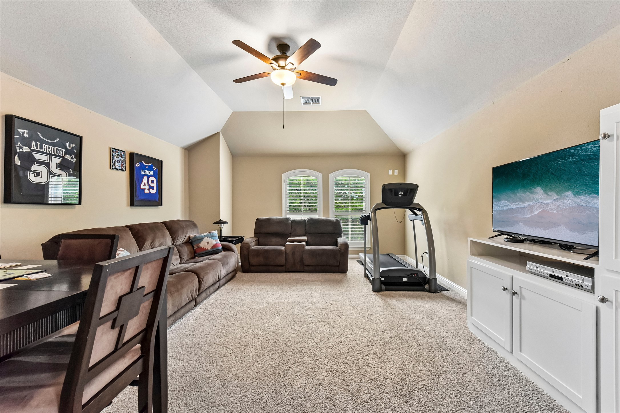 10216 Anahuac Trail Austin, TX 78747 - Photo 10 of 39 a living room with furniture a flat screen tv and a window