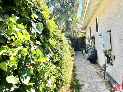 a backyard of a house with lots of green space