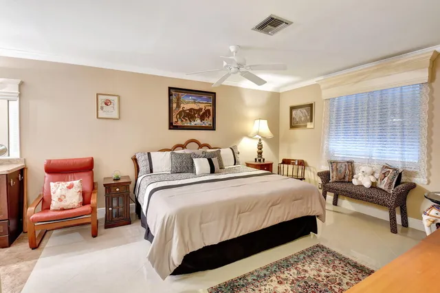 a bedroom with bed and a couch