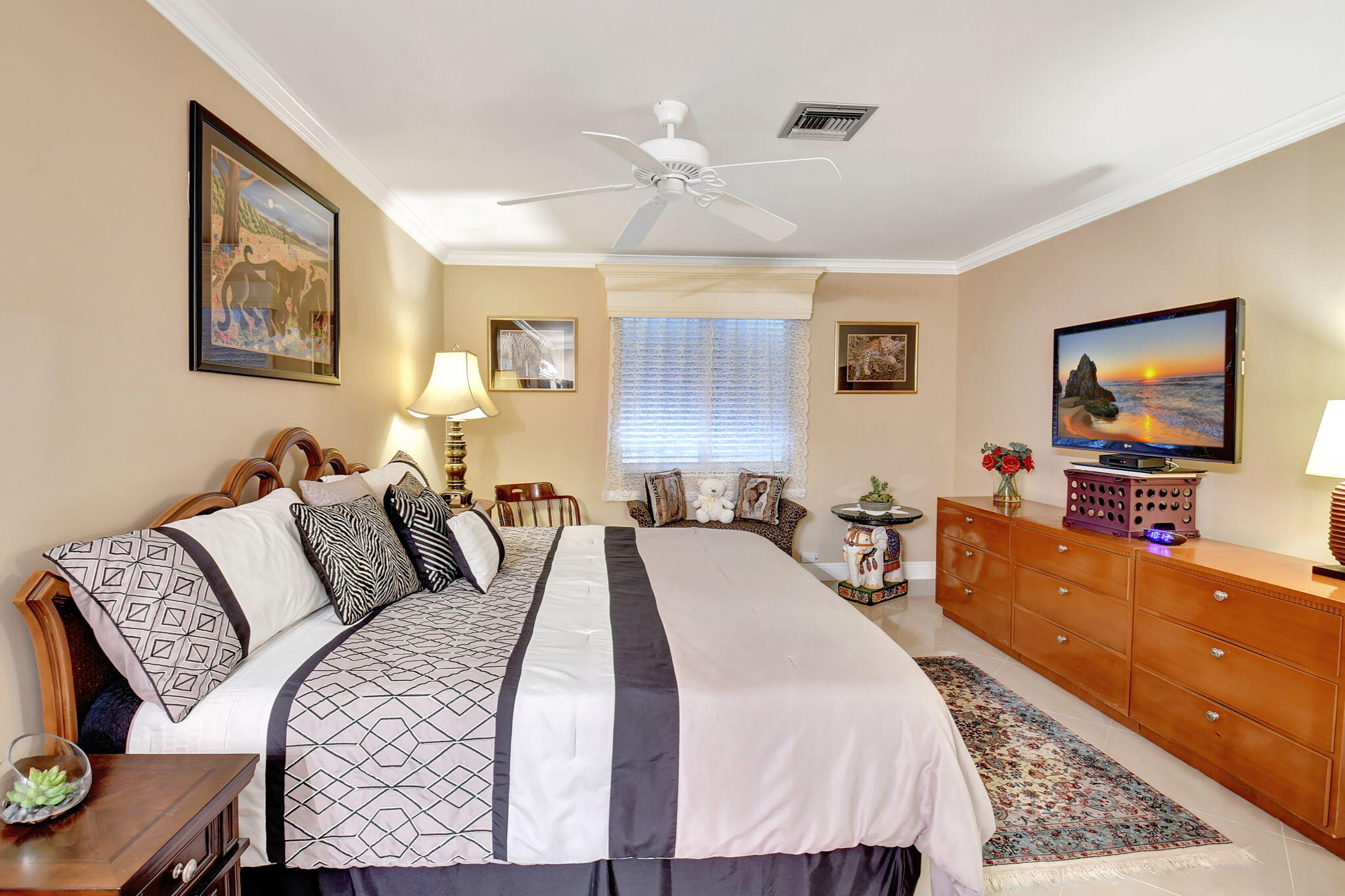 2721 Southwest 15th Street, Unit 203 Delray Beach, FL 33445 - Photo 19 of 55 a bed room with bed and a flat screen tv