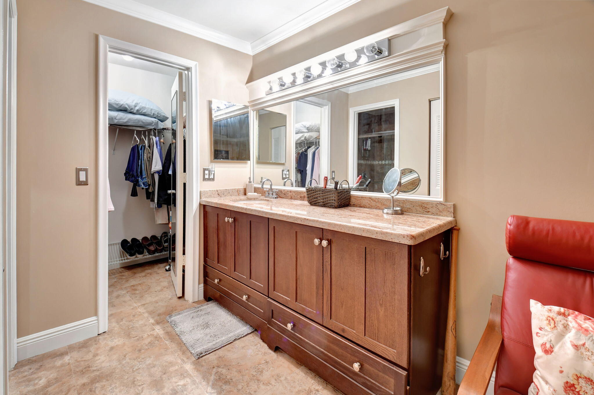 2721 Southwest 15th Street, Unit 203 Delray Beach, FL 33445 - Photo 22 of 55 a bathroom with a sink and a mirror