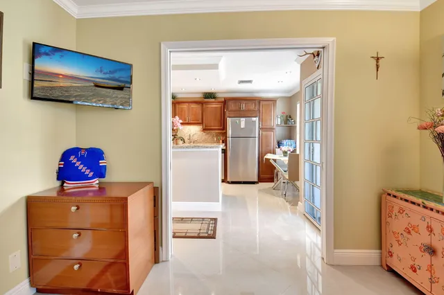 a bathroom with a shower a mirror and sink