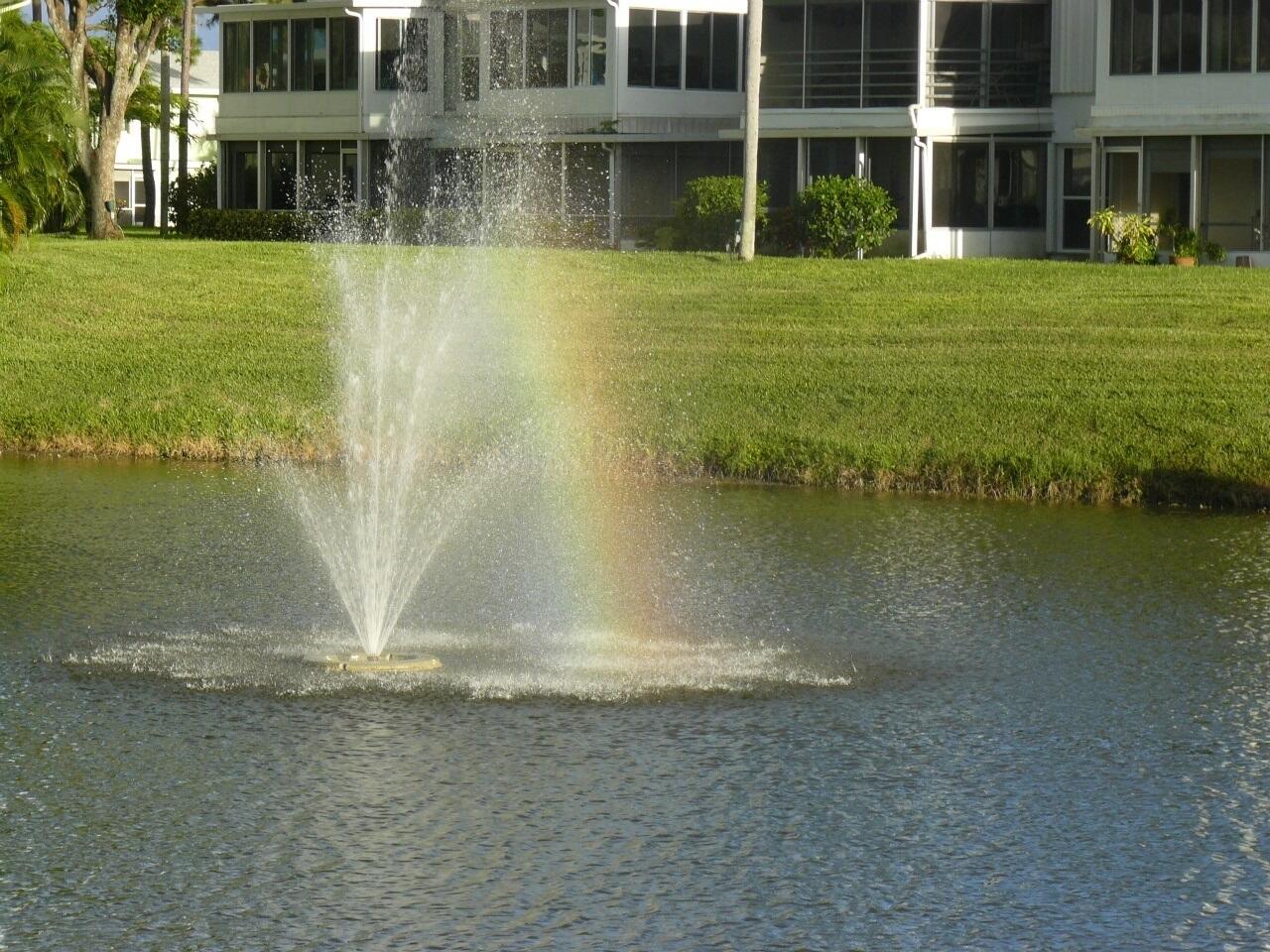 2721 Southwest 15th Street, Unit 203 Delray Beach, FL 33445 - Photo 46 of 55 a view of a water pond with lots of trees