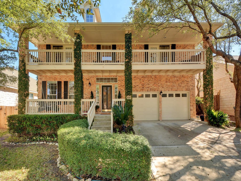 2929 Grimes Ranch Road Austin, TX 78732 - Photo 1 of 1 a front view of a house with a yard and lake view