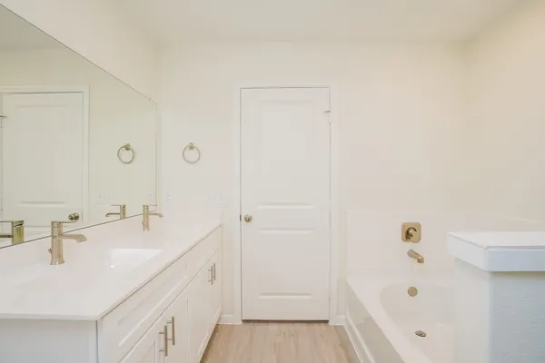 an empty room with window and ceiling fan