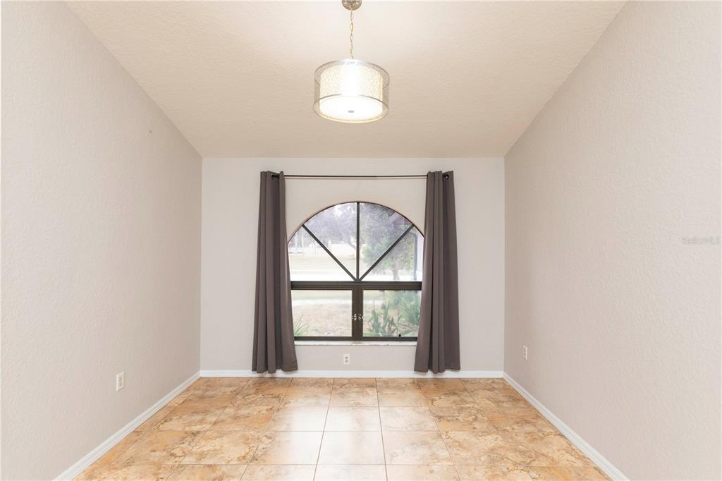 5701 Mossberg Drive New Port Richey, FL 34655 - Photo 17 of 58 a view of an empty room with a window
