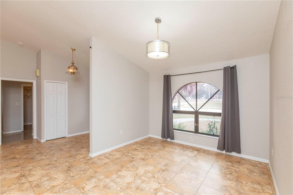5701 Mossberg Drive New Port Richey, FL 34655 - Photo 18 of 58 an empty room with windows and closet