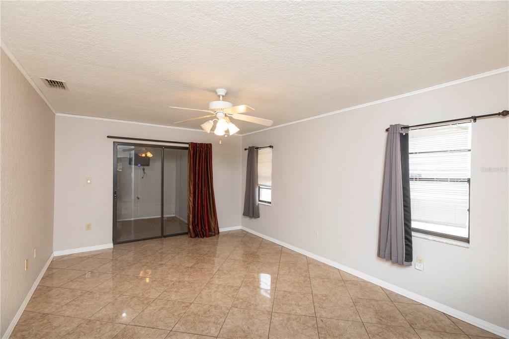 5701 Mossberg Drive New Port Richey, FL 34655 - Photo 21 of 58 wooden floor in an empty room with a window
