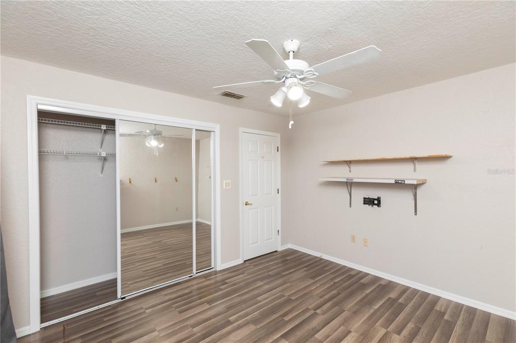 5701 Mossberg Drive New Port Richey, FL 34655 - Photo 31 of 58 wooden floor in an empty room