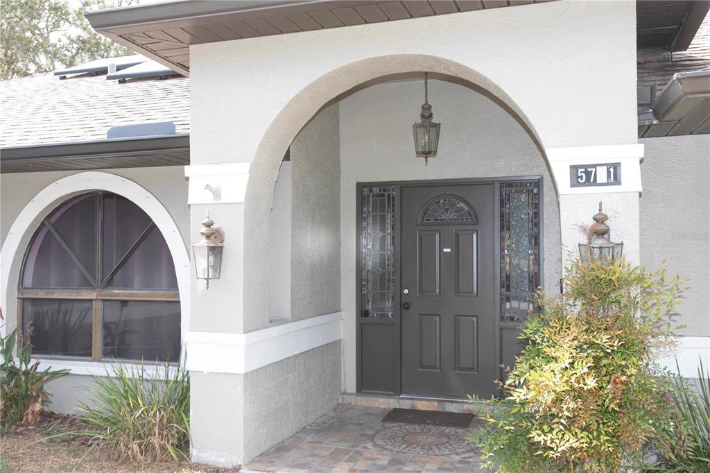 5701 Mossberg Drive New Port Richey, FL 34655 - Photo 4 of 58 a view of entryway with garden