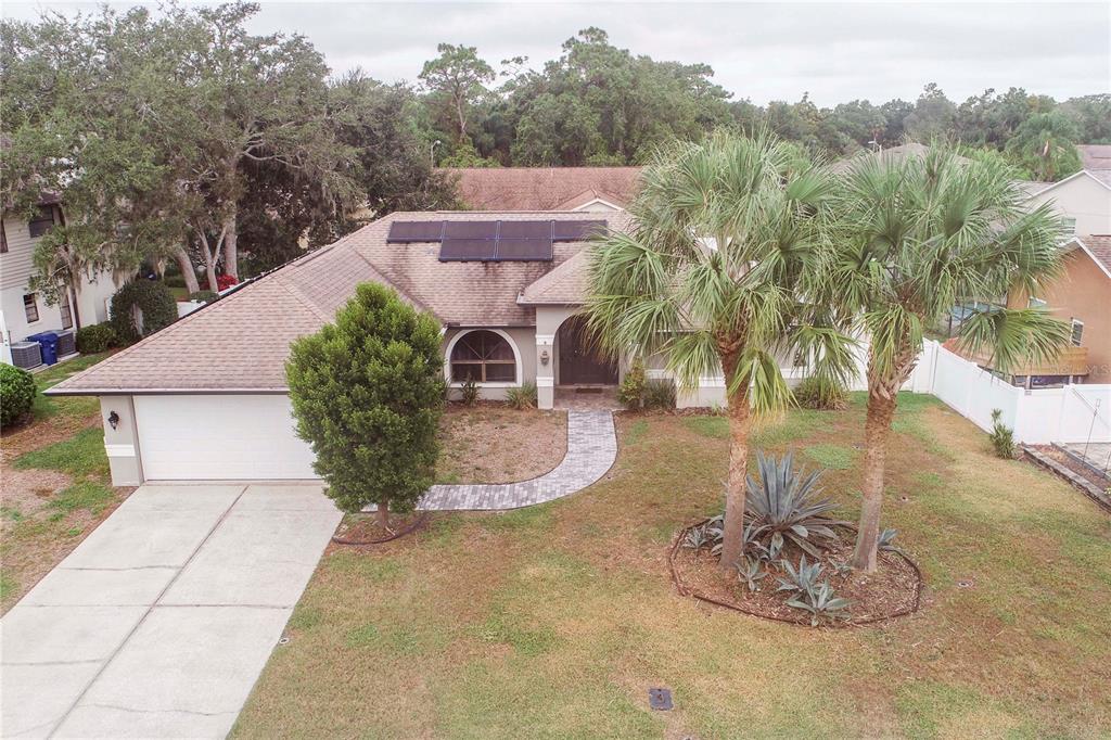5701 Mossberg Drive New Port Richey, FL 34655 - Photo 50 of 58 a view of a swimming pool with a yard
