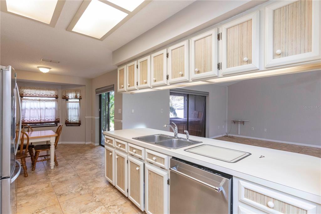 5701 Mossberg Drive New Port Richey, FL 34655 - Photo 6 of 58 a kitchen that has a sink and chair