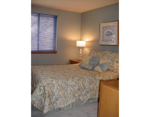 7 Lyman Road Framingham, MA 01701 - Photo 5 of 6 a bedroom with a bed and a lamp with window