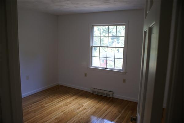 40 Old County Road Holland, MA 01521 - Photo 8 of 13 a view of wooden floor and windows in a room