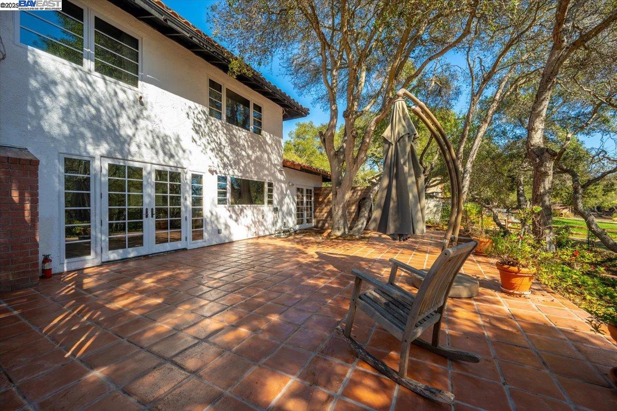 298 St Andrews Way Lompoc, CA 93436 - Photo 35 of 56 a view of a chairs and table in the backyard of the house