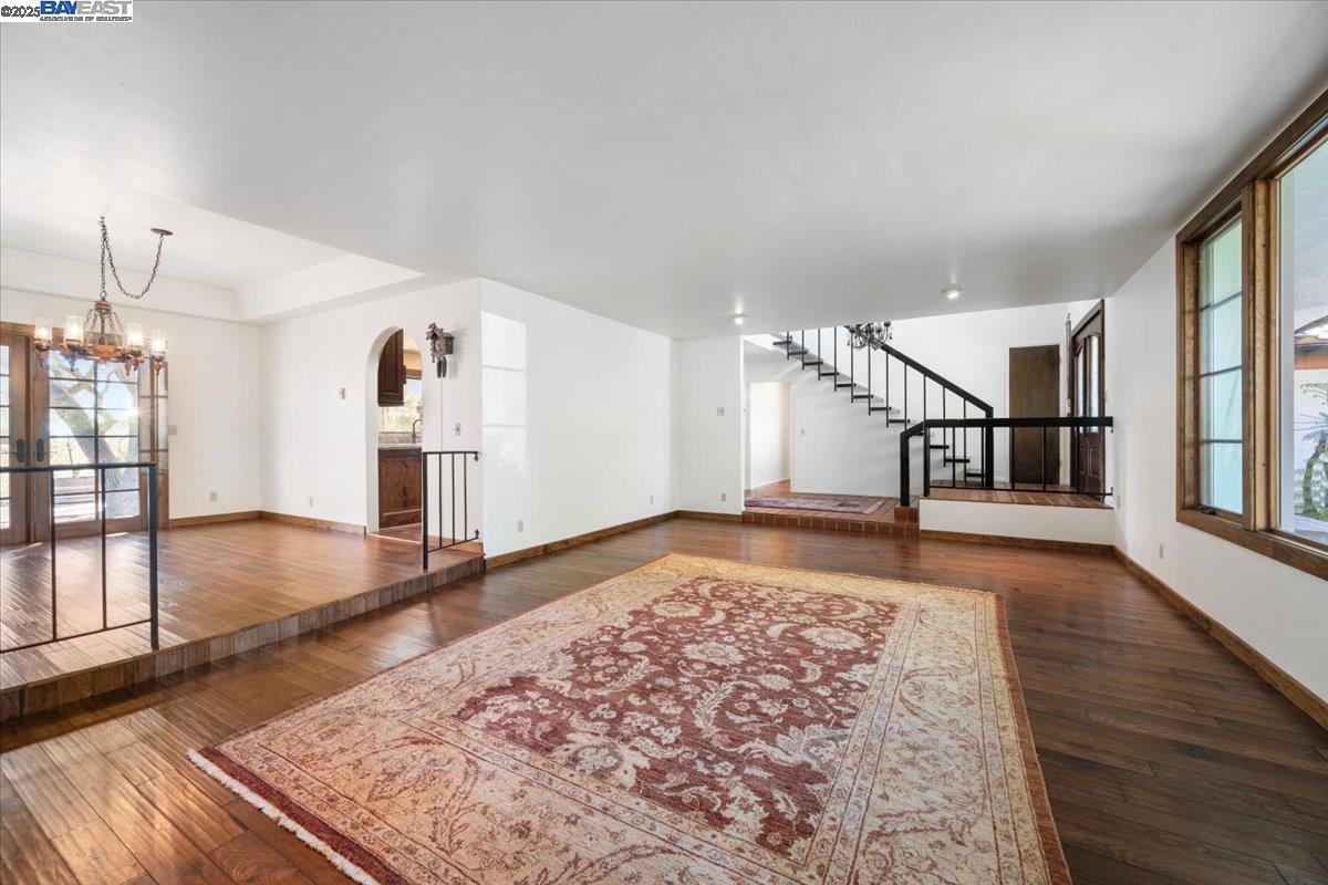 298 St Andrews Way Lompoc, CA 93436 - Photo 10 of 56 an empty room with wooden floor and windows