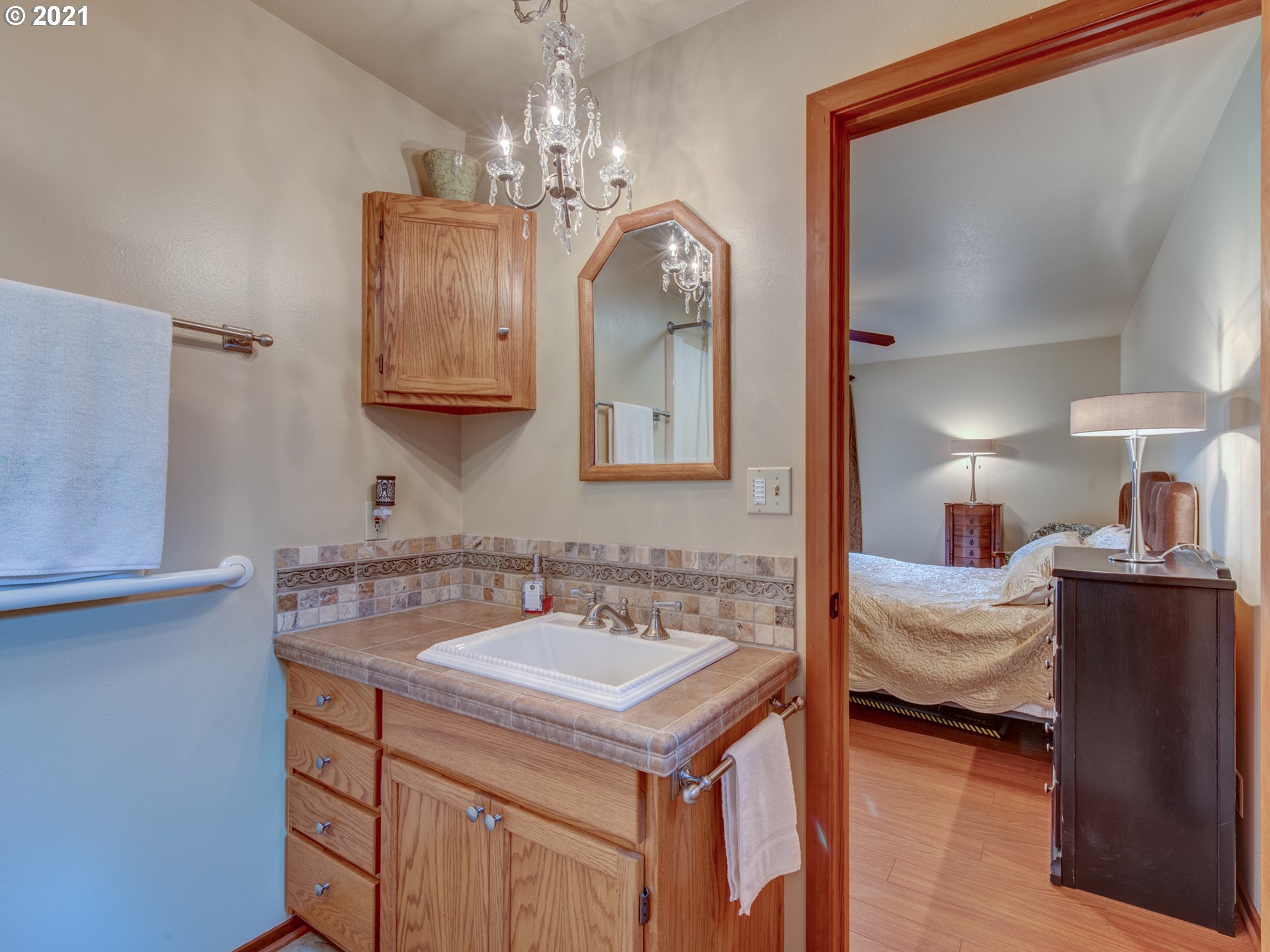 372 South 57th Place Springfield, OR 97478 - Photo 14 of 29 a en suite bathroom with a double vanity sink and a mirror