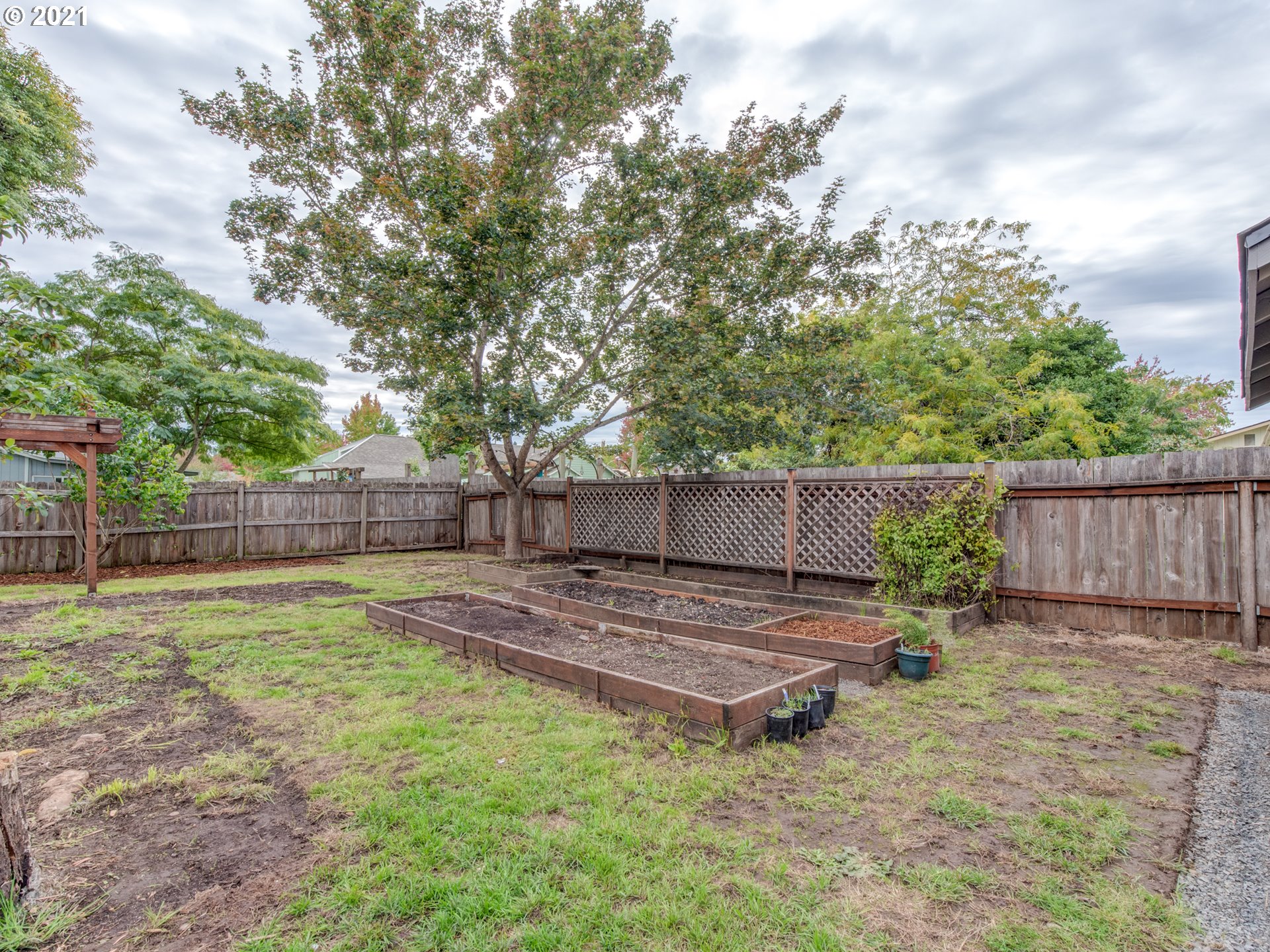 372 South 57th Place Springfield, OR 97478 - Photo 26 of 29 a backyard of a house with a table and chairs