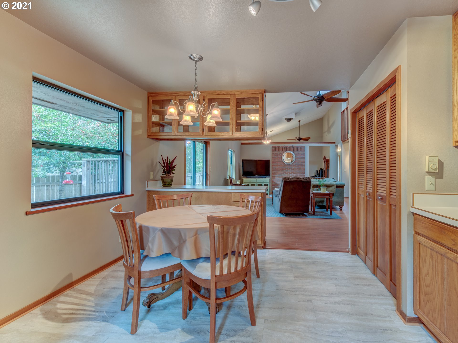 372 South 57th Place Springfield, OR 97478 - Photo 9 of 29 a view of a dining room with furniture wooden floor and chandelier