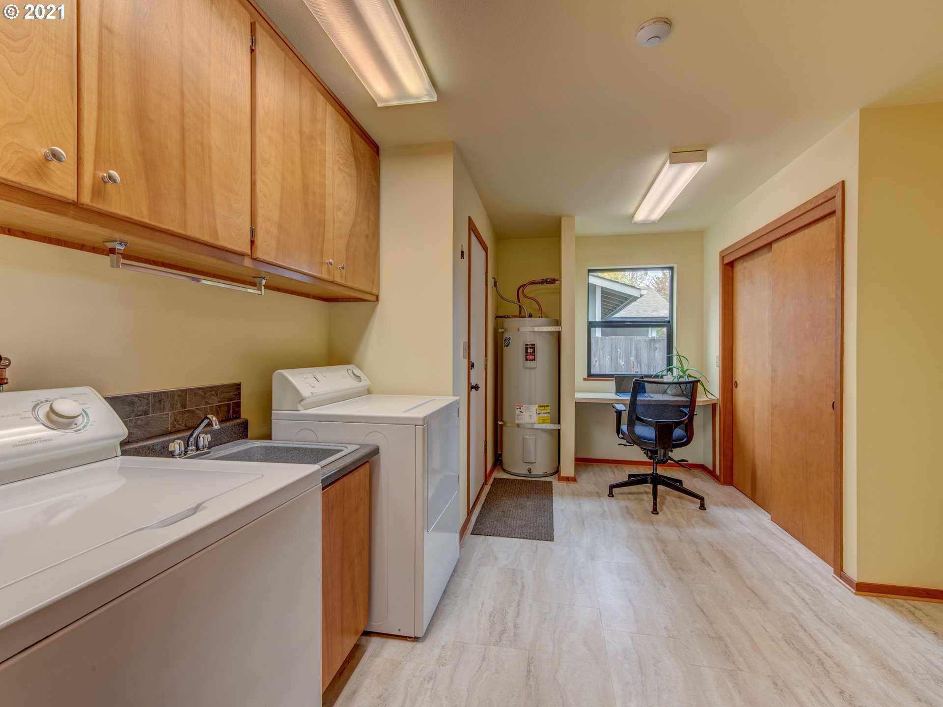 372 South 57th Place Springfield, OR 97478 - Photo 10 of 29 a view of a storage and utility room with washer and dryer
