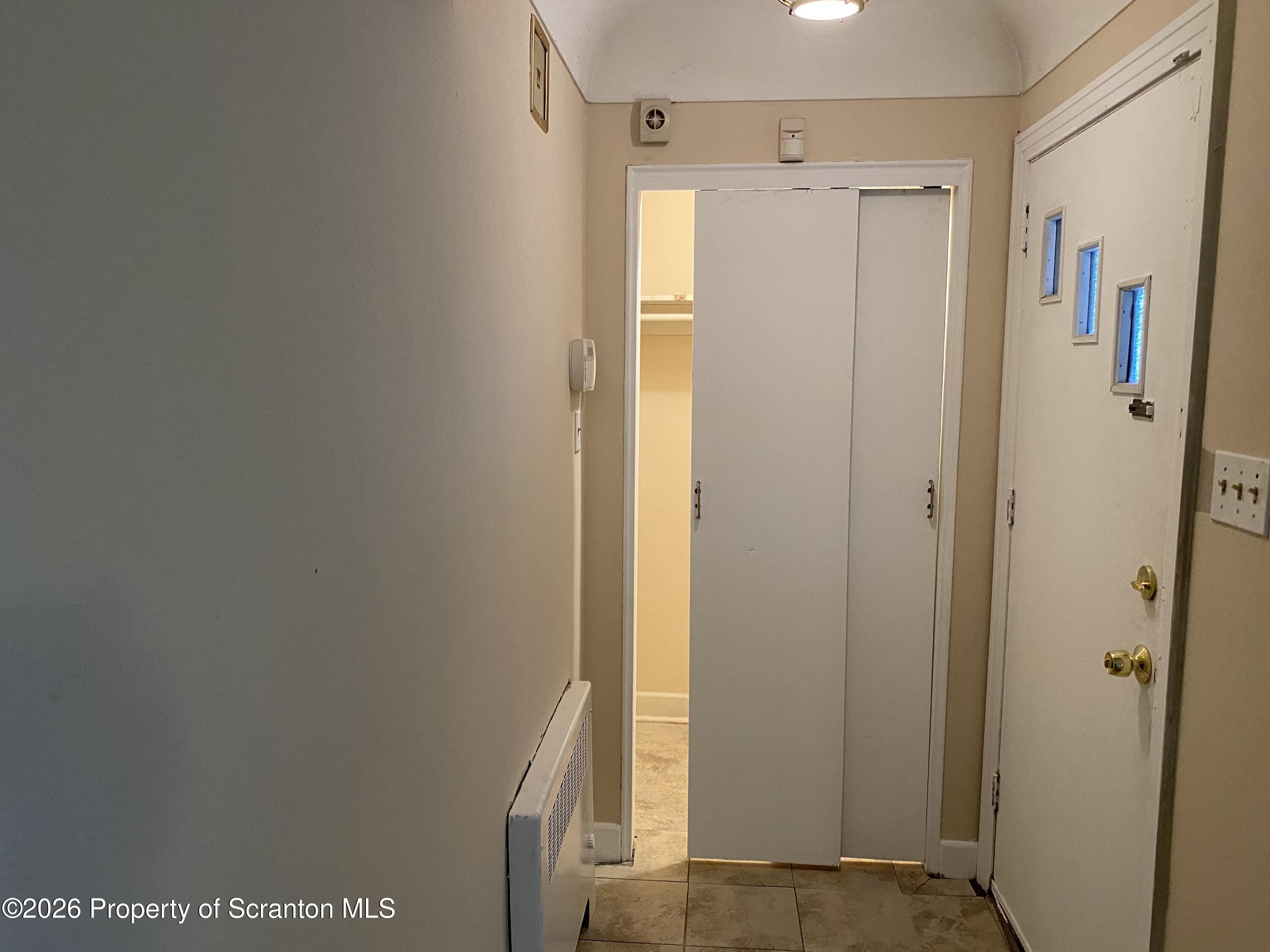 414 Orchard Street Scranton, PA 18505 - Photo 4 of 20 a view of a bathroom with a shower and a door