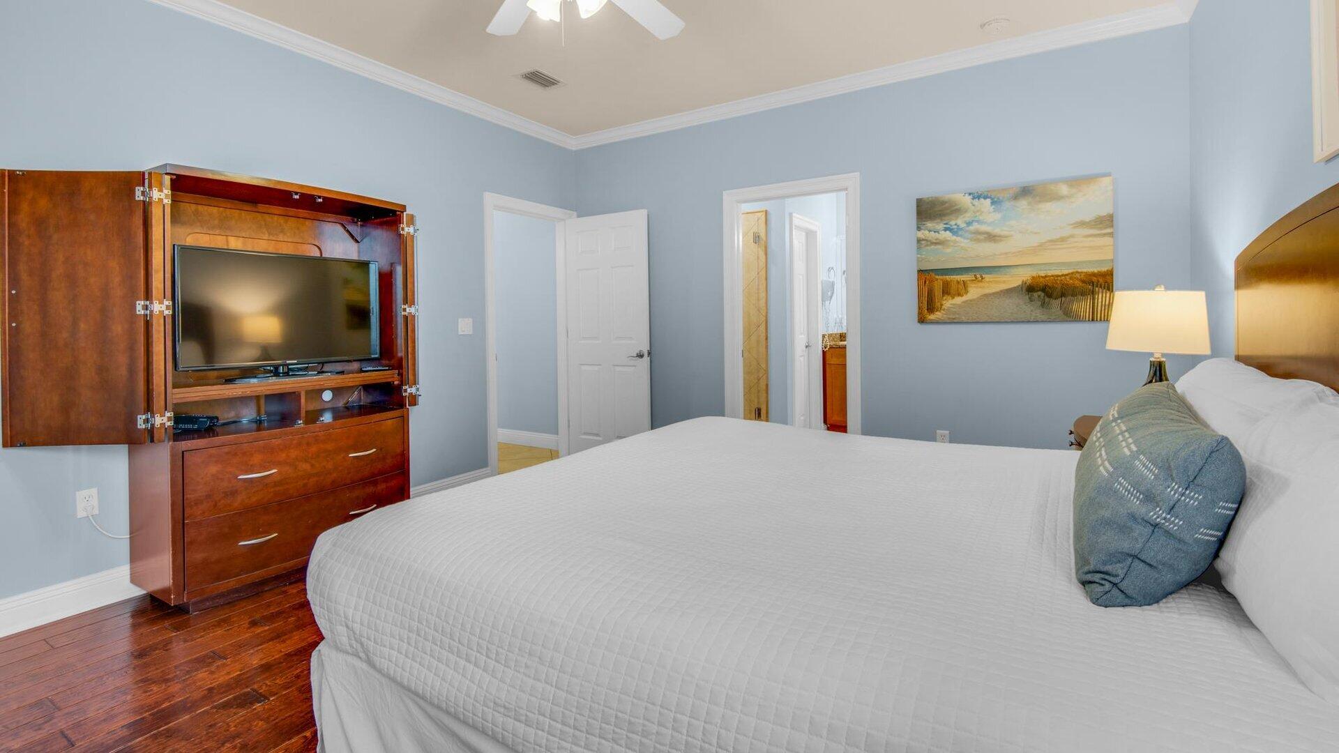 222 Kono Way Destin, FL 32541 - Photo 11 of 36 a bedroom with a bed and a flat screen tv