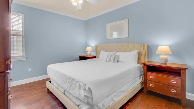 a bedroom with a bed and a lamp