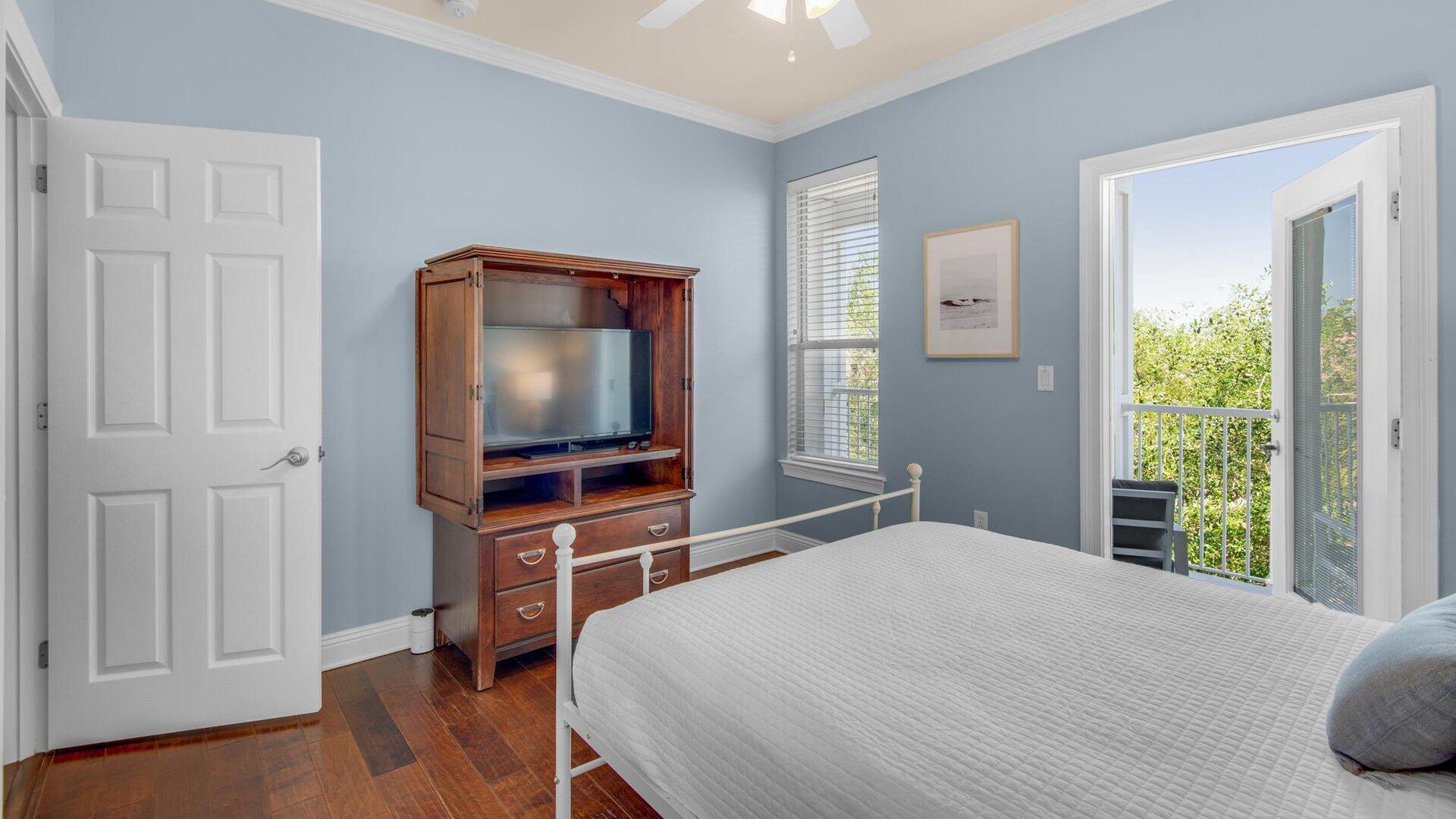 222 Kono Way Destin, FL 32541 - Photo 16 of 36 a bedroom with a bed and a flat screen tv