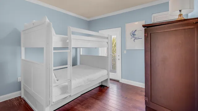 a view of an empty room and wooden floor