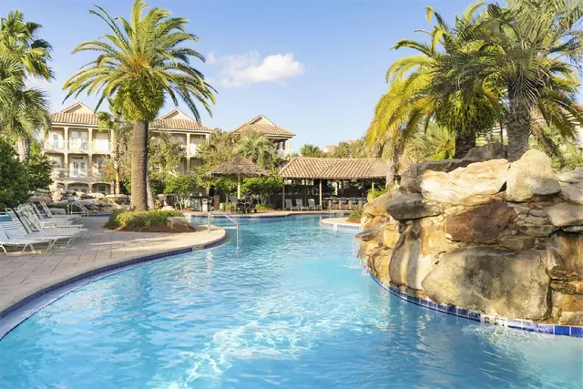 a view of a swimming pool with a yard