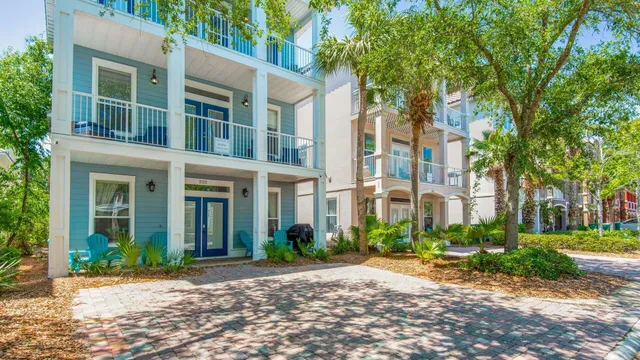 an aerial view of a swimming pool patio and outdoor seating