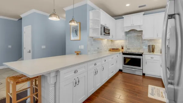 a kitchen with cabinets a sink and appliances