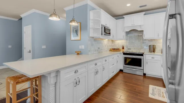 a kitchen with cabinets a sink and appliances
