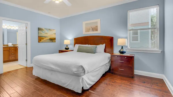 a bedroom with bed and window