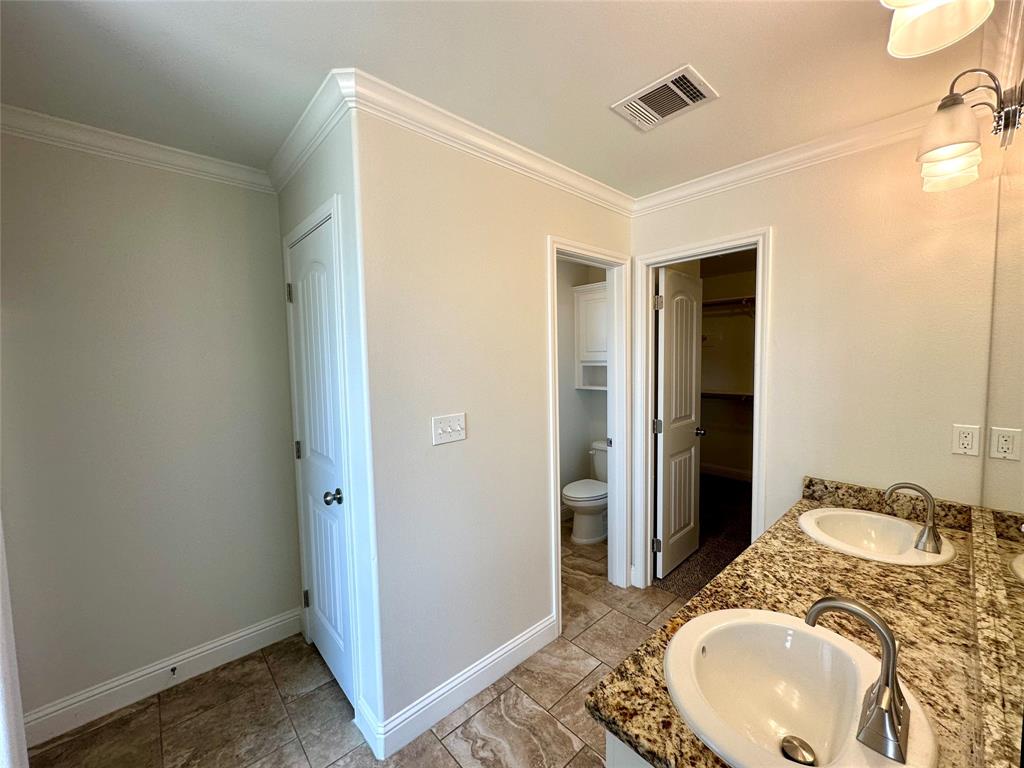 198 Bent Tree Loop Haughton, LA 71037 - Photo 13 of 32 a en suite bathroom with a granite countertop sink and a mirror
