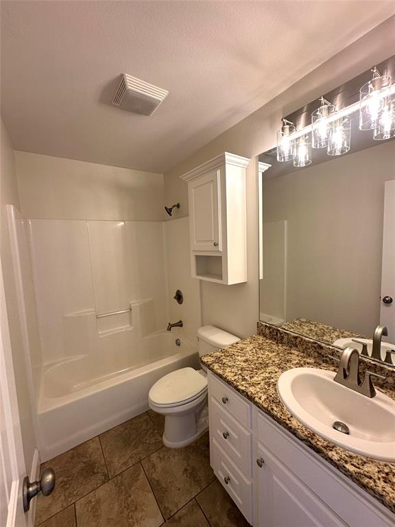 198 Bent Tree Loop Haughton, LA 71037 - Photo 19 of 32 a bathroom with a granite countertop sink a toilet and shower