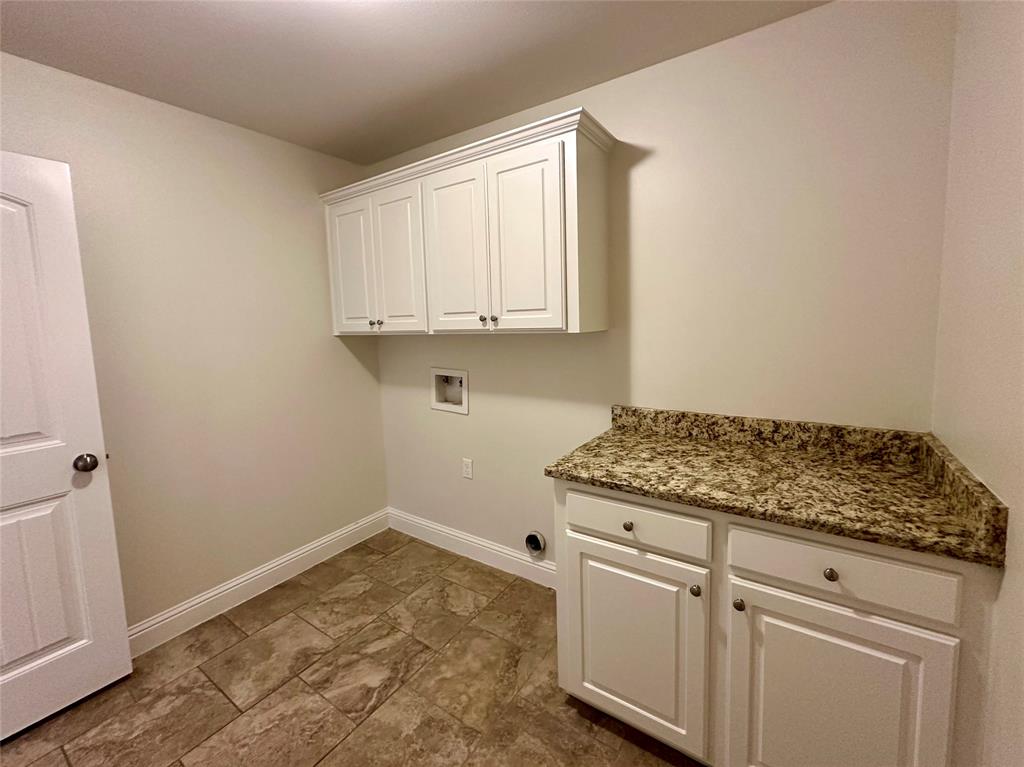 198 Bent Tree Loop Haughton, LA 71037 - Photo 30 of 32 a utility room with cabinets washer and dryer