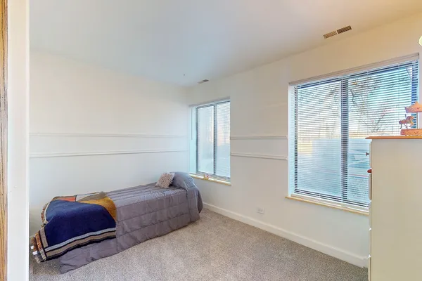 a room with a bed and a window