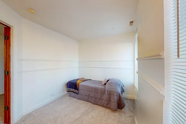 a room with a couch and a window
