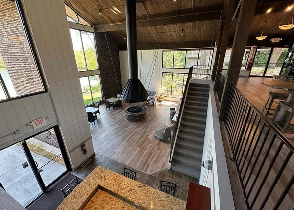 a view of a room with wooden floor