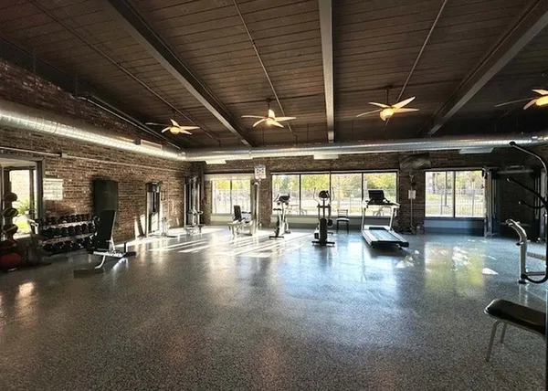 a view of a patio with a table chairs and a potted plants
