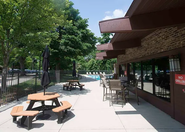 a view of a swimming pool with chairs