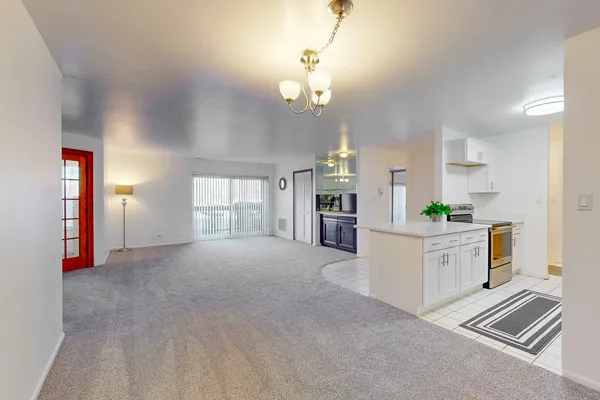 a view of a kitchen with furniture and window