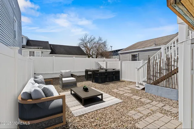 an aerial view of a house with a ocean view