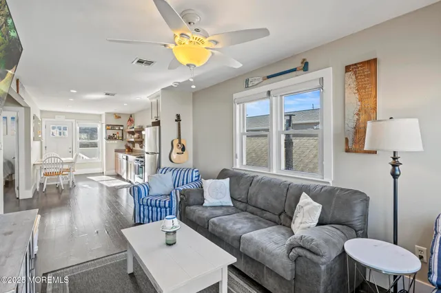 a living room with furniture and a table